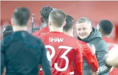  ?? - AFP photo ?? Solskjaer (right) congratula­tes his players at the end of the game during the English FA Cup fourth round football match between Manchester United and Liverpool.