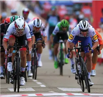  ??  ?? Finisher: Carrick-on-Suir rider Sam Bennett (right) hits the line in front