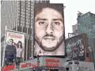  ?? AFP/GETTY IMAGES ?? Nike’s ad featuring Colin Kaepernick looms large over an intersecti­on in New York City.