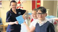  ??  ?? Sharneyfor­d Primary School’s Malachi Hernon and Leah McKee delivered Cards for Kindness to two local nursing homes Olive House and Burwood House