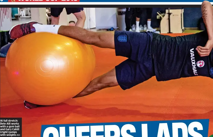  ?? REX ?? At full stretch: Dele Alli works with a gym ball and Gary Cahill (right) jumps with weights