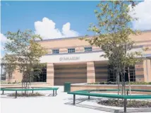  ?? JESSE KUNERTH/DREAMSTIME ?? A new suburban middle school in Florida. Real estate values are closely tied to perceived school quality in some areas.