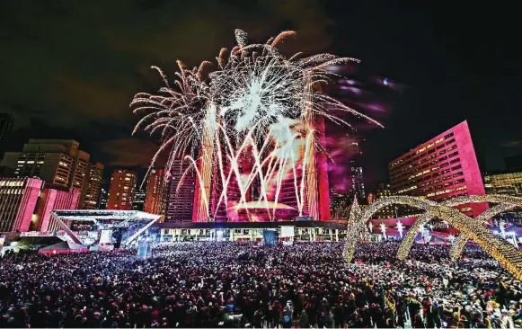  ?? THE CANADIAN PRESS FILE PHOTO ?? Toronto’s traditiona­l fireworks display marks midnight at Nathan Phillips Square, with DJs from 8 p.m. You can also skate the night away on Harbourfro­nt Centre’s Natrel Rink on Queens Quay.