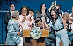  ??  ?? City Treasurer Melissa Conyears-Ervin and City Clerk Anna Valencia cheer during the speech.