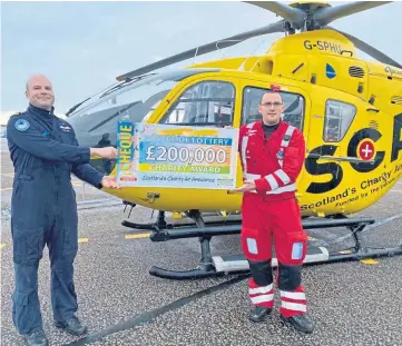  ??  ?? FLYING HIGH: SCAA pilot Captain Pete Winn and lead paramedic Ewan Littlejohn.