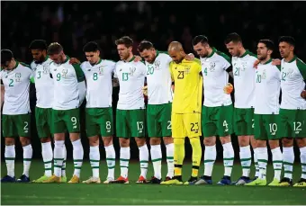  ?? Photo: Stephen McCarthy/Sportsfile ?? Silence: The Ireland team observe a minute’s silence prior to the match with Denmark as a mark of respect to David Clerkin.