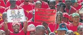  ?? Picture: AFP ?? Union members express their view on land expropriat­ion during last month’s Saftu strike.