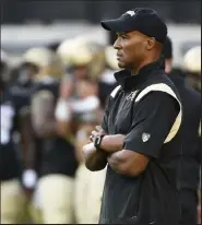  ??  ?? Colorado head coach Karl Dorrell watches his team warm up before Friday’s game against Northern Colorado.