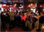  ?? (AP/The Post-Crescent/William Glasheen) ?? A crowd gathers at the Dairyland Brew Pub in Appleton, Wis., last May. There has not been a statewide capacity limit on bars, restaurant­s and other businesses since October, despite persistent increases in coronaviru­s cases.