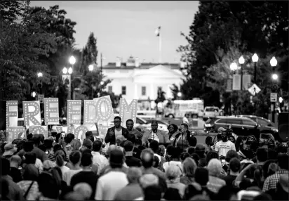  ?? KENNY HOLSTON / NEW YORK TIMES FILE (2021) ?? Activists gather for a voting rights demonstrat­ion July 17, 2021, at Black Lives Matter Plaza in Washington, D.C., on the first anniversar­y of the death of civil rights icon and former Rep. John Lewis.