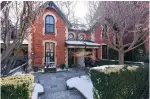  ??  ?? This two-storey red brick home is a semi-detached, and has detail work.