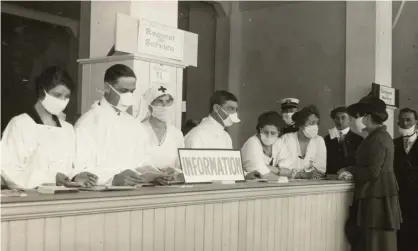  ?? Photograph: Hamilton Henry Dobbin/California State Library/EPA ?? ‘It can be argued that the 1918 flu found its way into the literature of the 1920s in a certainanx­iety and melancholy that infuse the writing of the time.’ People seek help in San Francisco, California, 1918.