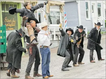  ?? Photo courtesy Gayle Dougall ?? Members of the Gunfighter­s Stunt Club prepare to string up a colleague as part of a staged lynching. From left: Colin Hollywood, Rod Vergouwen, Clint Huish (up top), Justin Greve, Keith Brickman and Wes Whitaker.