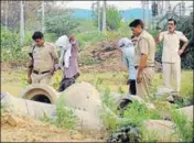  ??  ?? Police inspect the scene of crime with the accused, in Rohtak on Sunday. PTI PHOTO