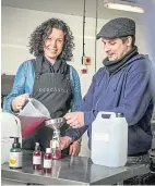  ??  ?? Gin firm director Angela Jarron with distiller Lewis Scothern.