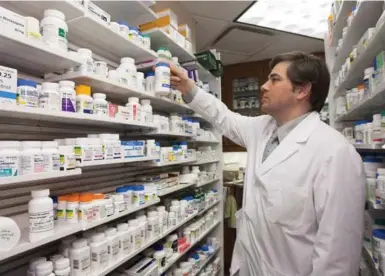  ?? JACQUES BOISSINOT/THE CANADIAN PRESS FILE PHOTO ?? Canadians spend more than $29 billion annually on prescripti­on medication­s, second only to hospitals in health-care spending.