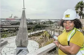  ?? ?? CROSS OF AGES: Mandela Bay Developmen­t Agency project manager Thandie Mafu at the St Peter’s site with the Fisherman’s Cross sculpture