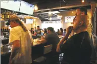  ?? Jordan Grice / Hearst Connecticu­t Media ?? Soccer fans at the Whiskey Barrel in Stratford watch as Portugal and Spain play on Friday in the World Cup.