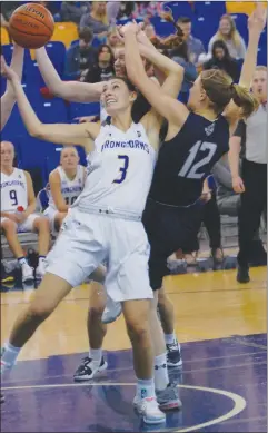  ?? Herald photo by Dale Woodard ?? Katie Keith of the University of Lethbridge Pronghorns goes up for a rebound against Sydney Tabin of the Mount Royal University Cougars in Canada West play Saturday night at the 1st Choice Savings Centre.