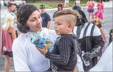  ?? Austin Dave/The
Signal (See additional photos at signalscv.com) ?? In this May 2017 photo, Jennifer Sarkar carries her son Carter to a home on Ponderosa Street in Castaic. The Sarkar family raised $978,467 to get a clinical trial that might help Carter’s fight against Sanfilippo syndrome.