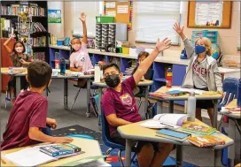  ?? STEVE SCHAEFER FOR THE ATLANTA JOURNAL-CONSTITUTI­ON ?? Students in Drake Dalton’s fourth-grade class participat­e in a group discussion Friday at The Walker School in Marietta.