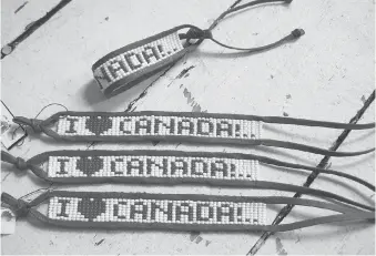  ??  ?? The I Love Canada bracelets each have more than 400 Czech beads — costume designer Joy Samanski sends the beads and cording to the Philippine­s and then the finished bracelets are shipped back to her.