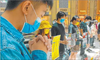  ?? Vincent Yu The Associated Press ?? Protesters gather Tuesday at a shopping mall during a demonstrat­ion against Beijing ’s national security law in Hong Kong.