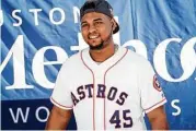  ?? Michael Minasi / Houston Chronicle ?? Houston Astros pitcher Michael Feliz smiles before handing out autographs during a toy drive on Saturday, Dec. 9, 2017, at Houston Methodist Emergency Care Center in The Woodlands.