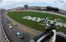  ?? (James Gilbert/getty Images) ?? Austin Dillon, driver of the #3 BREZTRI Chevrolet, takes the checkered flag to win the weather-delayed Cup Series Coke Zero Sugar 400 at Daytona Internatio­nal Speedway Sunday.