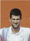  ?? AP PHOTO ?? GOOD ENOUGH: Novak Djokovic celebrates after his straight-sets victory against Jaume Munar yesterday in the second round of the French Open.