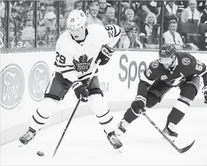  ?? CHRIS O’MEARA THE ASSOCIATED PRESS ?? Toronto Maple Leafs centre William Nylander gets past Tampa Bay Lightning defenceman Braydon Coburn during the first period Tuesday in Tampa, Fla. For the game result, go to our website.