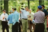  ?? Carol Kaliff / Hearst Connecticu­t Media ?? Joel Lindsay, center, of Ameresco Candlewood Solar LLC, leads a walking tour in 2017 for the state Siting Council of the area where the proposed solar panels on Candlewood Mountain would go.