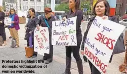  ??  ?? Protesters highlight the domestic victimizat­ion of women worldwide.