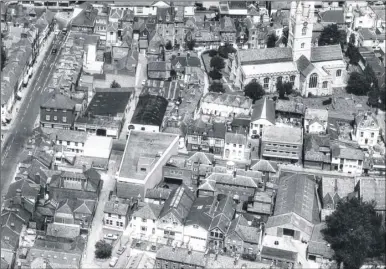  ??  ?? An aerial picture of Ashford town centre in 1966, with the police station in Tufton Street, opposite the Swan pub, with its distinctiv­e tower