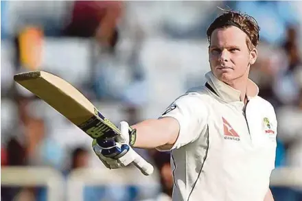  ?? AFP PIC ?? Australia captain Steve Smith raises his bat in celebratio­n after scoring a century during the first day of the third Test yesterday.