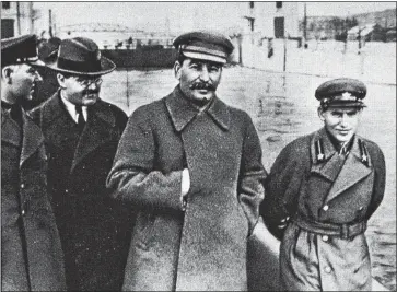  ??  ?? ERASING HISTORY: Stalin with three lieutenant­s, including Nikolai Yezhov, above, far right, in Moscow in 1937. Just 12 months later Yezhov was murdered in a purge – and his image scrubbed from photos