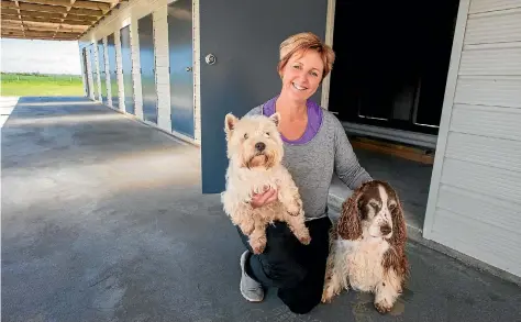  ?? PHOTO: MYTCHALL BRANSGROVE/FAIRFAX NZ ?? Robynne Trainor with West Highland white Jo Jo, left, and DJ, are set to welcome new friends to the doggy daycare on Arowhenua Road.