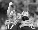  ?? STEPHEN M. DOWELL/ORLANDO SENTINEL ?? Orlando Pride star Marta, center, celebrates with teammates after scoring during the 2018 season. Marta is among 10 Pride players whose options have been exercised by the club.