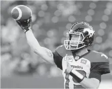  ?? JOHN WOODS, THE CANADIAN PRESS ?? Stampeders quarterbac­k Bo Levi Mitchell unloads a throw against the Blue Bombers in Winnipeg on Thursday.