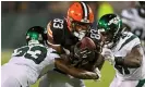  ?? ?? Cleveland Browns tight end Zaire Mitchell-Paden (83) is tackled by New York Jets linebacker Claudin Cherelus (41) and Jimmy Moreland during the second half of Thursday’s game. Photograph: Dave Richard/AP