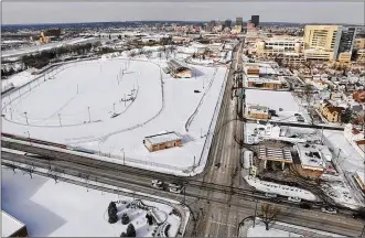  ?? TY GREENLEES / STAFF ?? The old Montgomery County Fairground­s (left), is shown from the South Main Street and Stewart Street intersecti­on. The University of Dayton and Premier Health have received more than 1,300 ideas about what to do with the site.