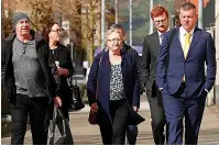  ??  ?? Watching the trial... McCann’s family and their lawyer arrive for the hearing at Belfast Crown Court yesterday
