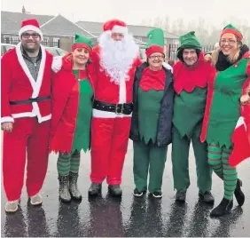  ??  ?? Festive fun Volunteers at the Elf and Snowman trail