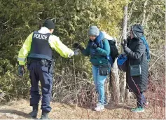  ??  ?? File photo shows two women from Sudan being helped by the RCMP at the US/ Canada border, in Champlain, NY. — AFP photo
