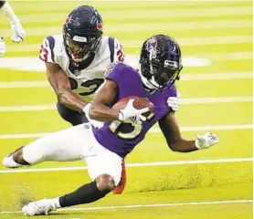  ?? MATT PATTERSON/AP ?? Ravens wide receiver Marquise Brown is tackled by the Texans’ Eric Murray.