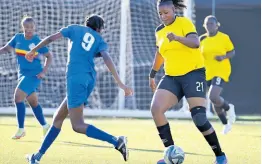  ?? RICARDO MAKYN/CHIEF PHOTO EDITOR ?? Cavalier’s Sashana Watson takes on Proven’s Keylee Edwards during the opening game of the Sherwin Williams Jamaica Women’s Premier League at the UWI-JFF Captain Horace Burrell Centre of Excellence yesterday.