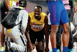  ??  ?? PAIN: Usain Bolt grimaces after pulling up in the relay in London last night