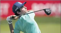  ?? CARLOS OSORIO — THE ASSOCIATED PRESS ?? Joaquin Niemann hits driver from the 16th tee during the second round of the Rocket Mortgage Classic on Friday. Nieman shares the tournament lead with Tom Lewis at 10-under-par 134.