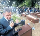  ?? PAULO SANTOS THE ASSOCIATED PRESS ?? Police Supt. José Roberto Peres speaks during a burial service for unidentifi­ed migrants.