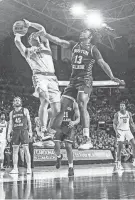  ?? KEN RUINARD/USA TODAY SPORTS ?? Clemson’s Joseph Girard III shoots near Boston College guard Donald Hand (13) on Saturday at Littlejohn Coliseum in Clemson.